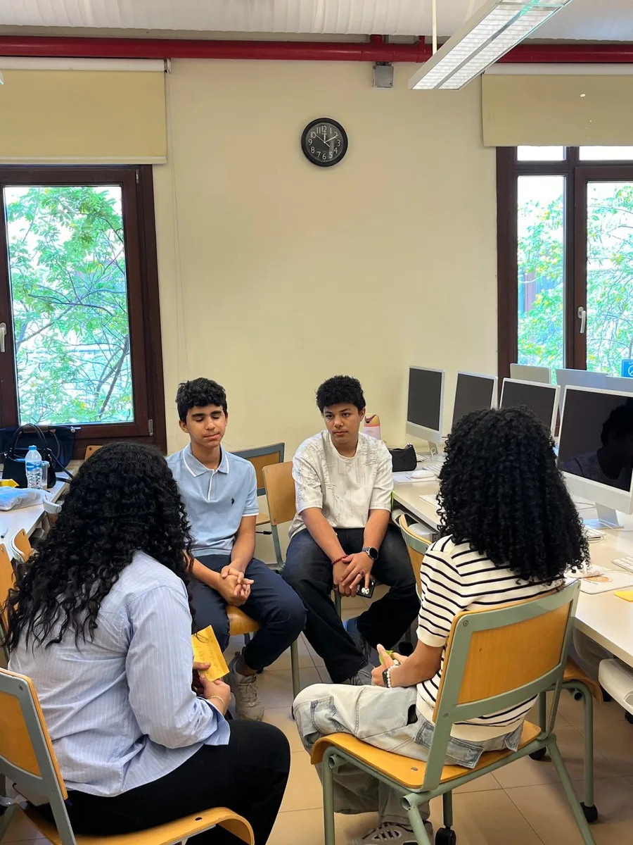 A facilitator running a paper prototype exercise with a room of students