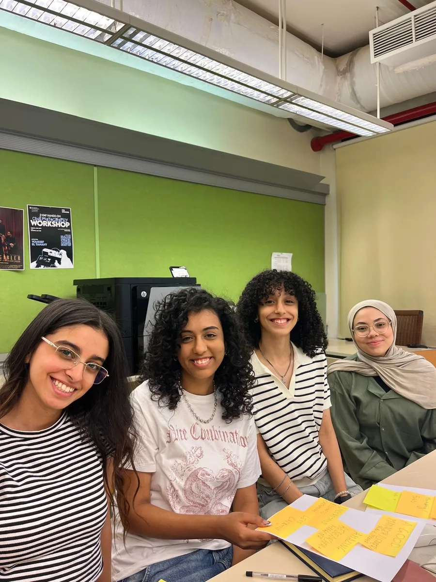 Four young founders smiling together at the Startopia AUC Bootcamp