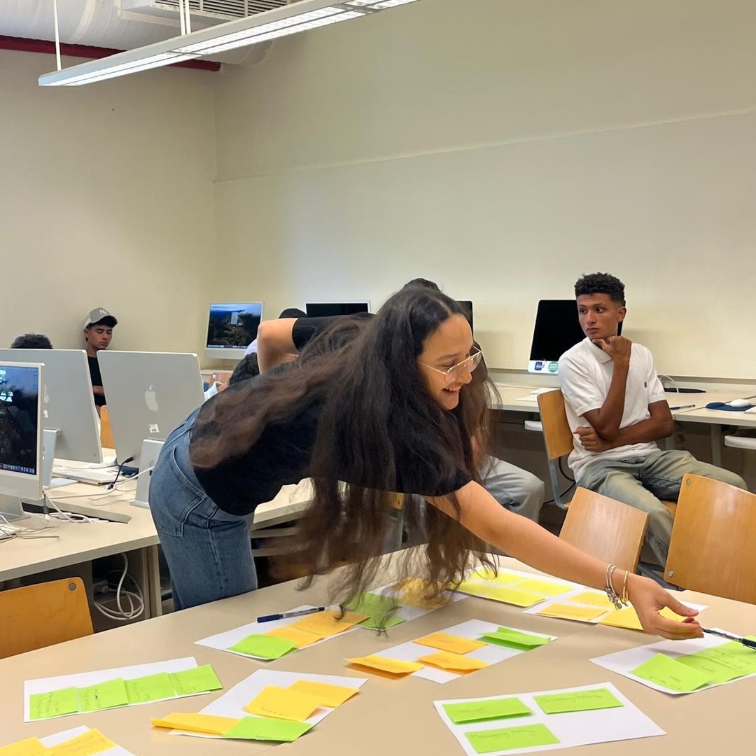 A student arranging evidence notes on a table