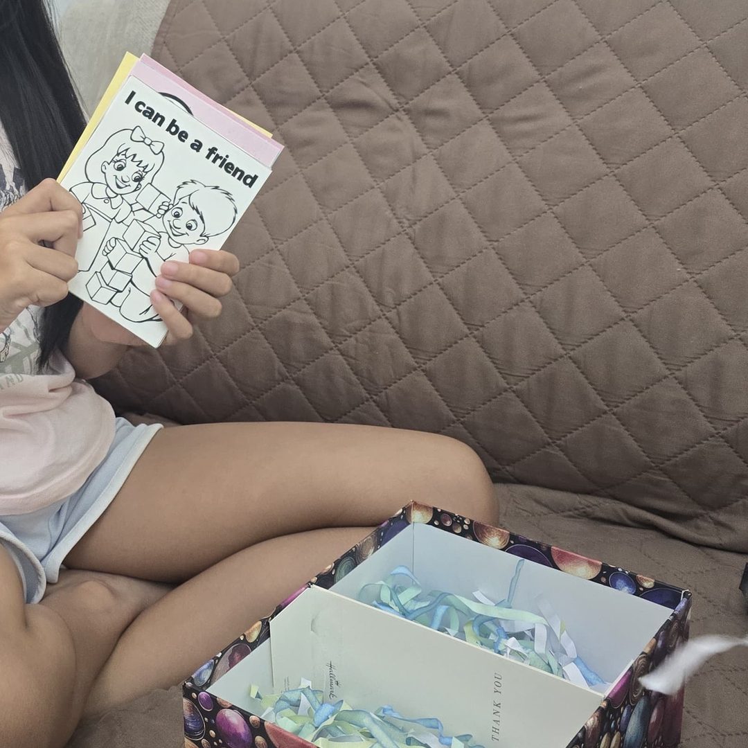 A young founder holding her finished product