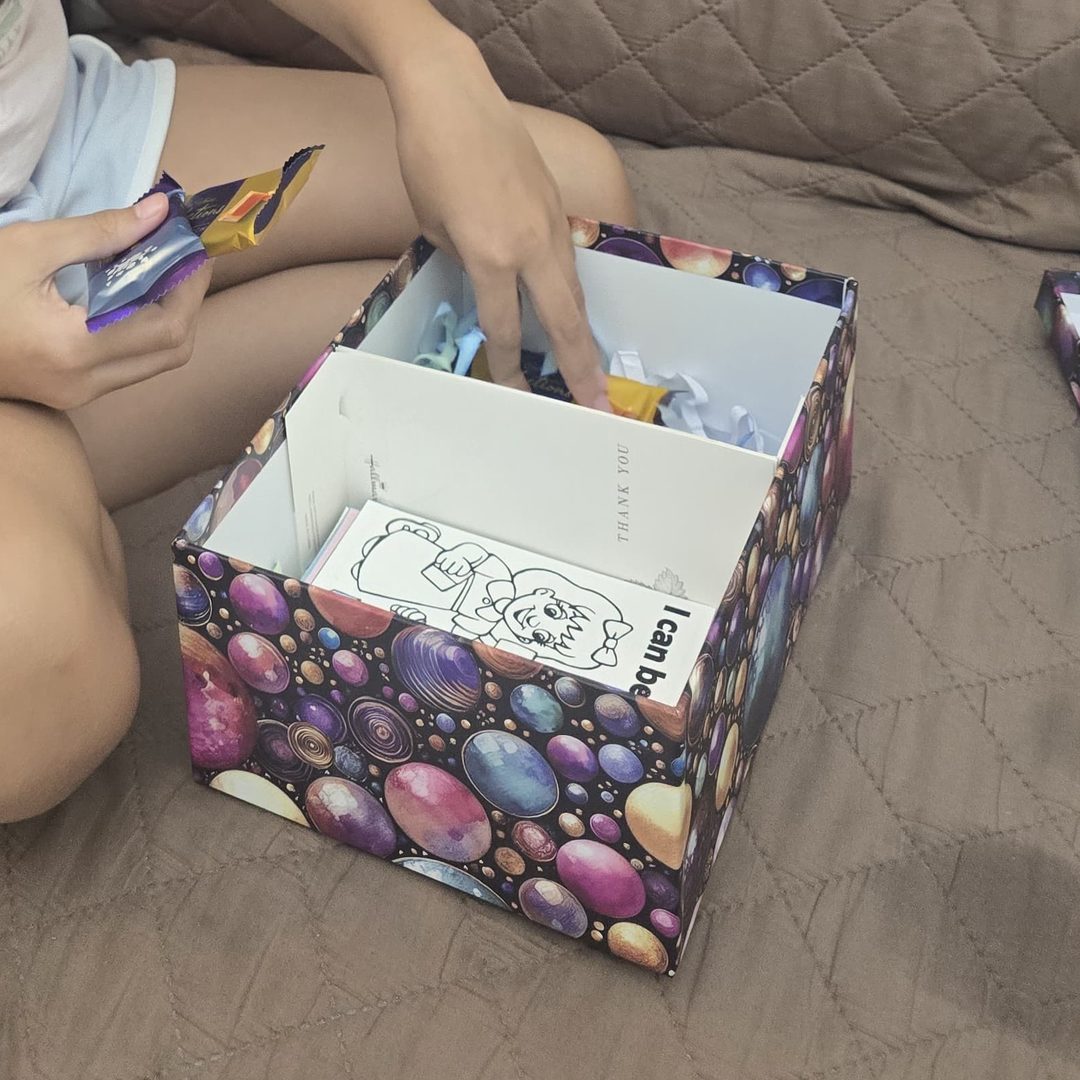 A young founder packing her product box