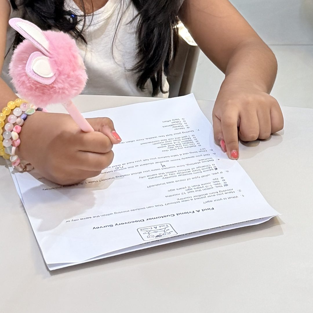 A young founder records answers on her survey